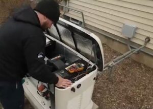 A technician servicing a generator